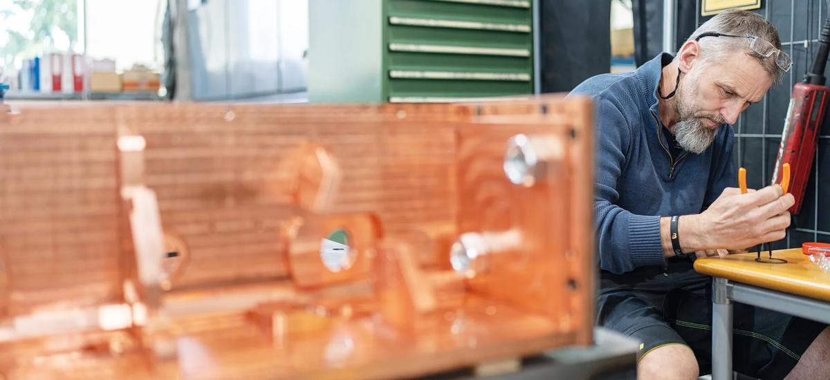 Applying the finishing touches to the ShapeMon, Ralf Ulbrich works directly with each component going into the copper housing.