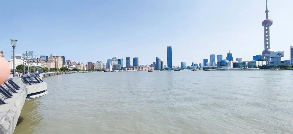 Called the "Bund," the waterfront area on the left side of this picture is one of Shanghai's protected areas and is breathtaking in its architectural diversity. To the right, the Pudong New Area is home to many financial institutions, housed in remarkable skyscrapers. The Oriental Pearl Tower (far right) was originally used for TV and radio broadcasting.