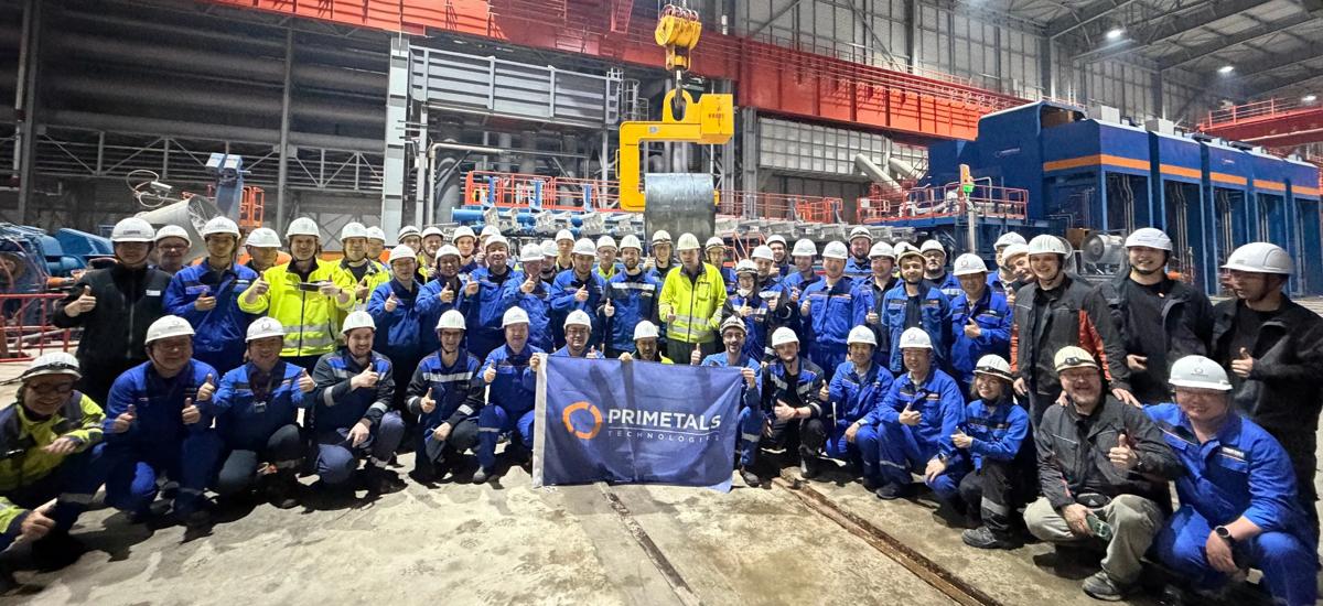 The Primetals Technologies team celebrates the first coil at Zhongshou Special Steel’s Arvedi ESP line. 