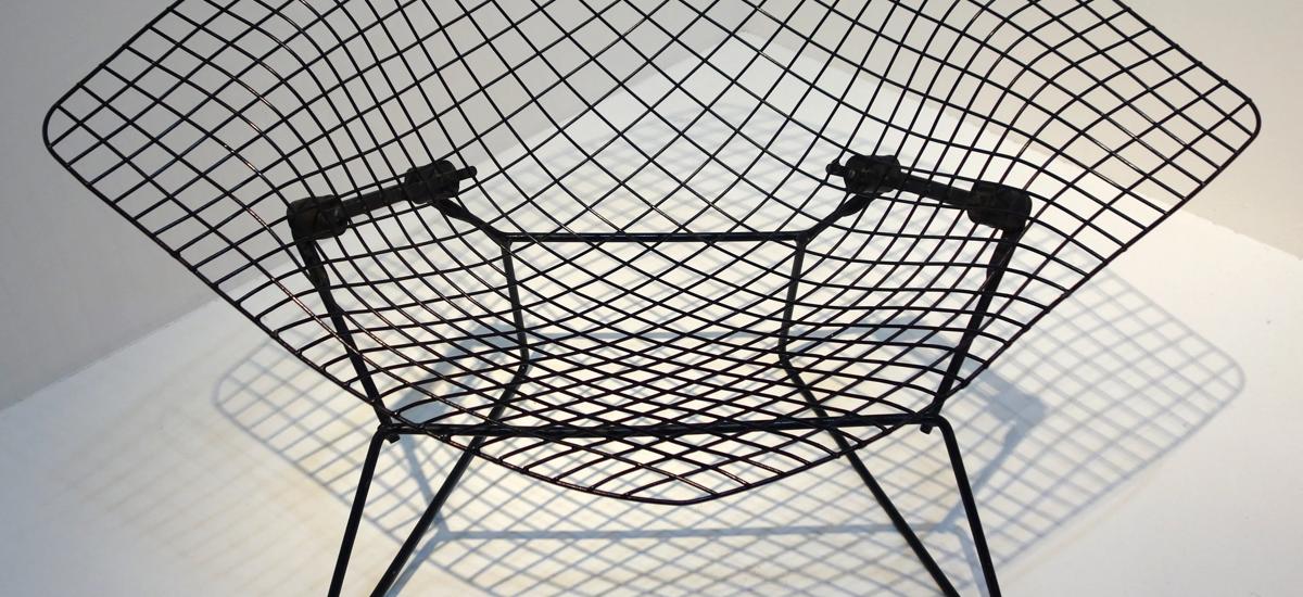 Bertoia Diamond Chair (1952) is an exploration of space and steel in a unique piece that creates something comfortable out of the industrial material.