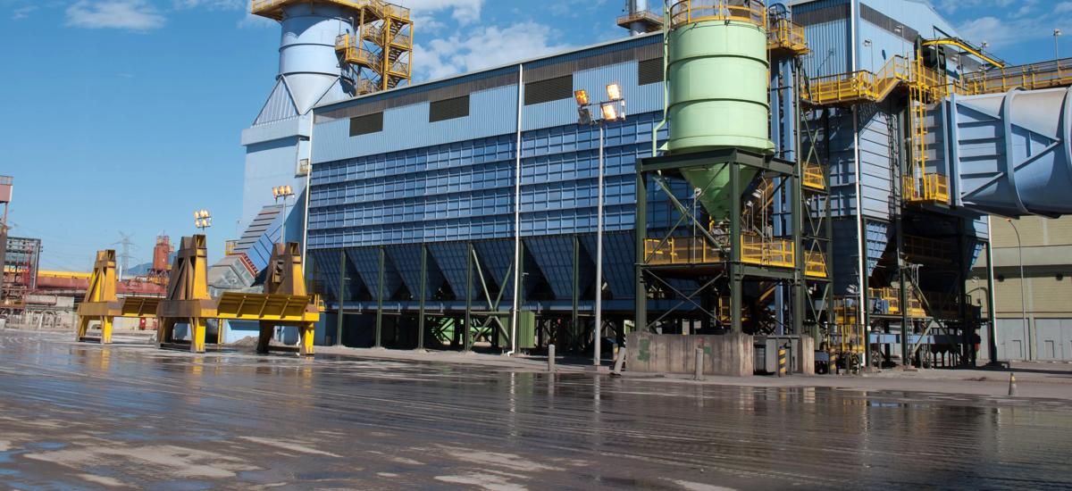 Bag filter including fans, clean gas stack and dust silo