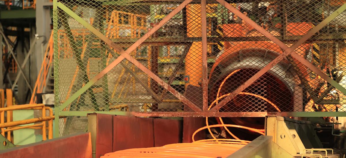 Morgan High-Speed Laying Head as coiled stainless steel bar exits onto the cooling conveyor