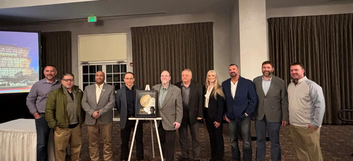 Pictured are the Primetals Technologies and NLMK teams standing alongside the Gold Reliability Achievement Award. 