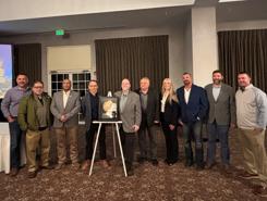 Pictured are the Primetals Technologies and NLMK teams standing alongside the Gold Reliability Achievement Award. 