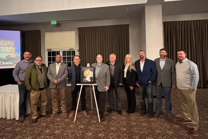 Pictured are the Primetals Technologies and NLMK teams standing alongside the Gold Reliability Achievement Award. 