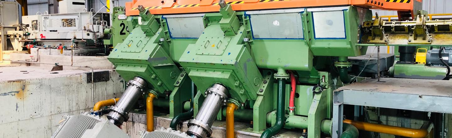 Front diagonal view of the 4-stand eDrive Morgan No-Twist Mill at a high-speed rebar mill