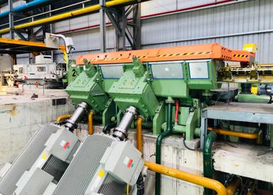 Front diagonal view of the 4-stand eDrive Morgan No-Twist Mill at a high-speed rebar mill