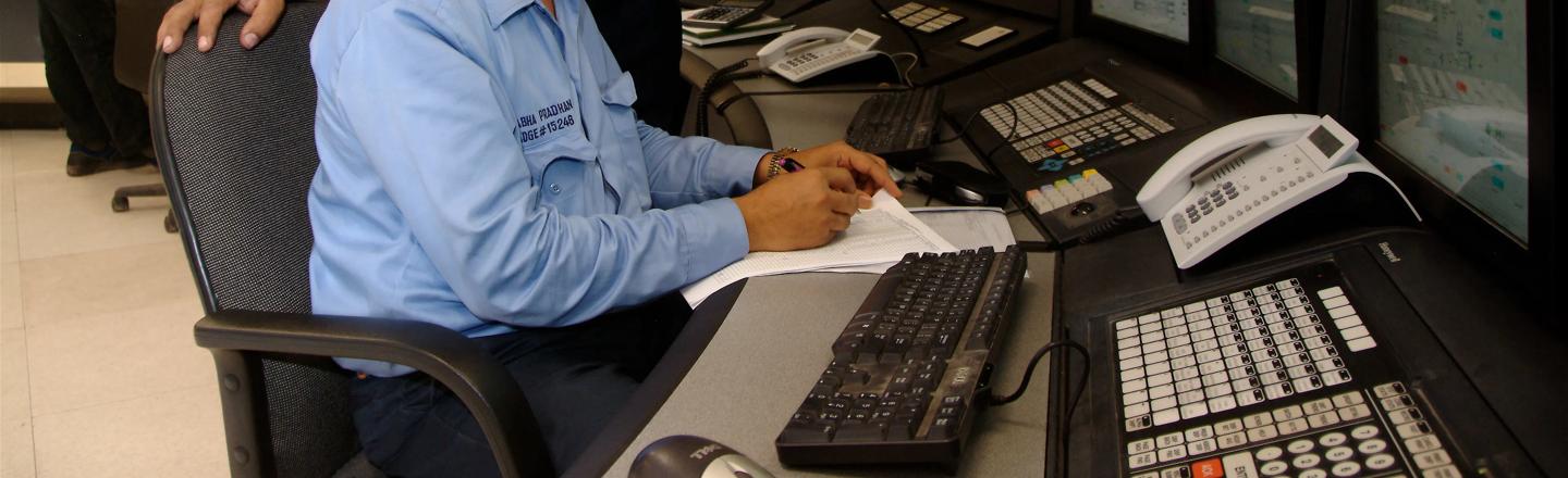 Two operators sitting in a direct reduction plant control room