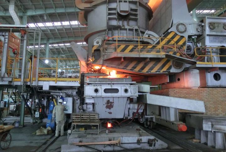 Two-strand continuous slab casters