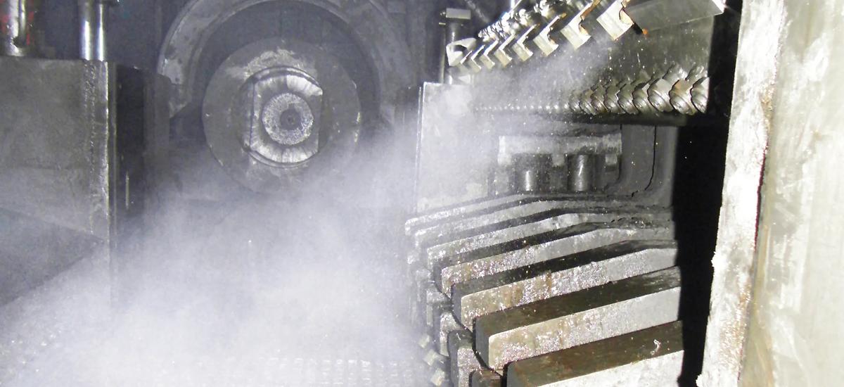 Photo of the MQL spray bar "on" at a European steel plant. 