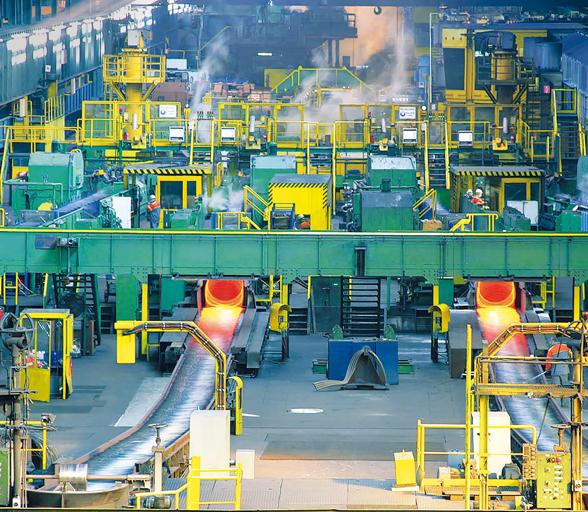 4-strand wire rod rolling mill showing hot rod exiting Laying Head onto Cooling Conveyor