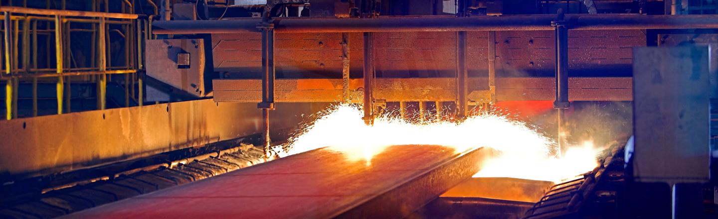 Torch cutting at slab caster