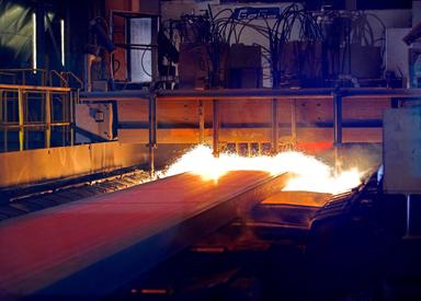 Torch cutting at slab caster