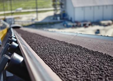 Iron ore pellets on a transport conveyor at ArcelorMittal Texas HBI (formerly voestalpine Texas).
