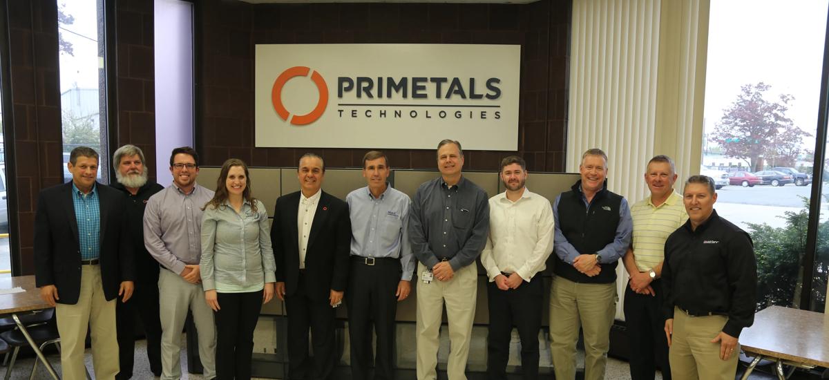 ExxonMobil and Primetals Technologies team gathers after lubrication agreement signing in Worcester, Mass., USA.