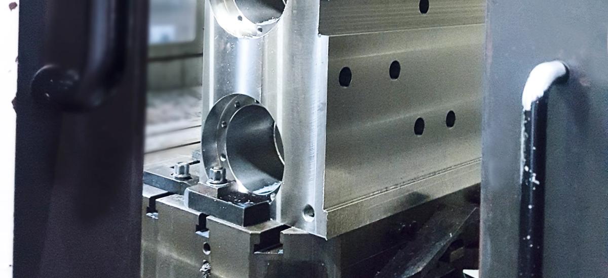 Image of a bending block inside of a machiner. 