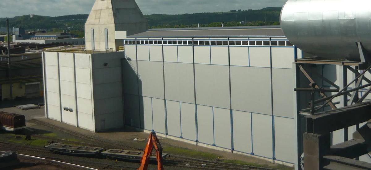 Outdoor dedusting facilities from Primetals Technologies on the Wetzlar site of Buderus Edelstahl GmbH in Germany. With a cleaning capacity of 2.4 million working cubic meters per hour, it is one of the largest systems of its kind in the world. It achieves a clean gas dust content of less than one milligram per standard cubic meter.