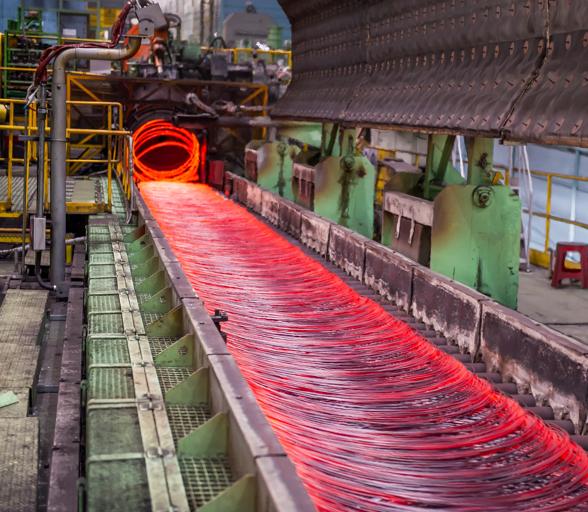 4-strand wire rod rolling mill showing hot rod exiting the Laying Head onto the Cooling Conveyor
