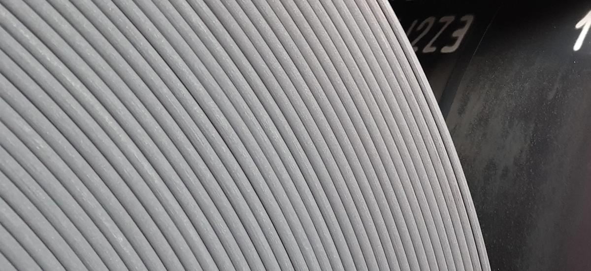Image of thick steel strip rolled on an Arvedi ESP line