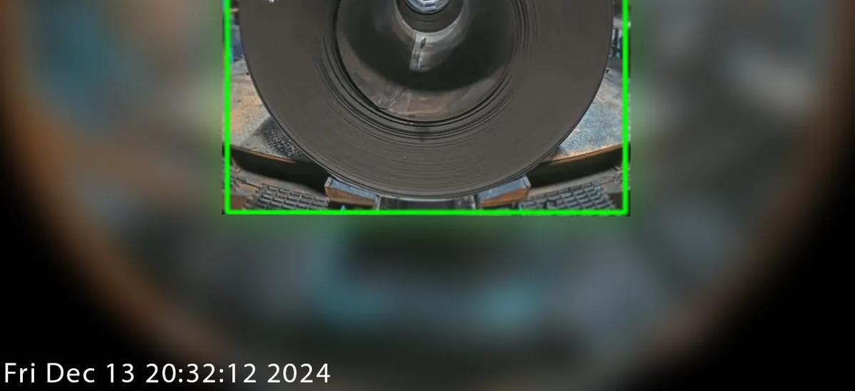 Coils in the entry and exit sections of a mill, each coil identified by numbers visibly marked on their surfaces. Vision-based artificial intelligence automatically recognizes and records these numbers, enabling efficient and accurate coil tracking for operators