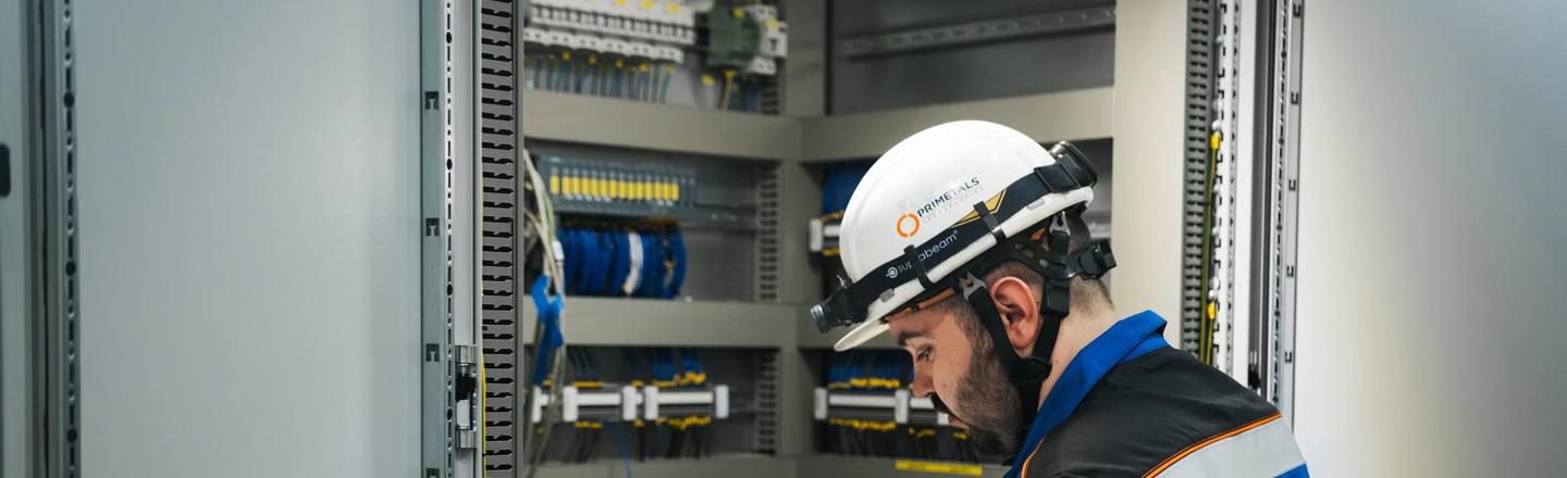 Maintenance engineer in front of control panel