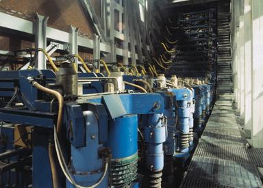 Continuous casting strand guides at the slab caster