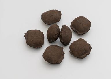 Pillow-shaped ferrous briquettes