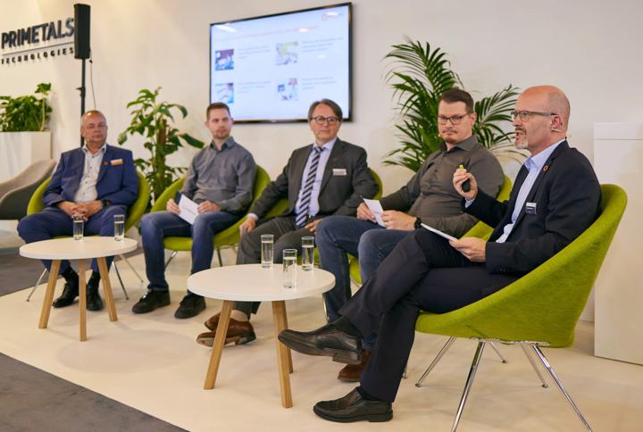 Photo of panelists at METEC 2023, including Wolfgang Oberaigner, Kurt Herzog, and Christoph Stangl from Primetals Technologies