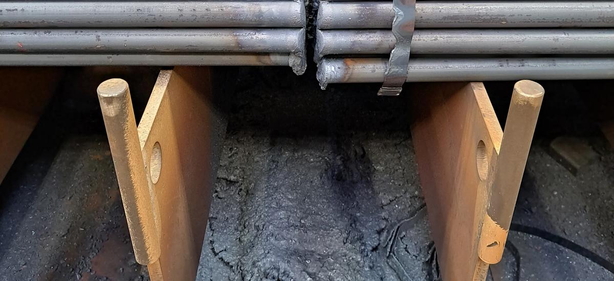 Scrap torch cutting pipes