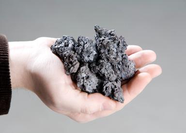 Image of a hand holding sinter