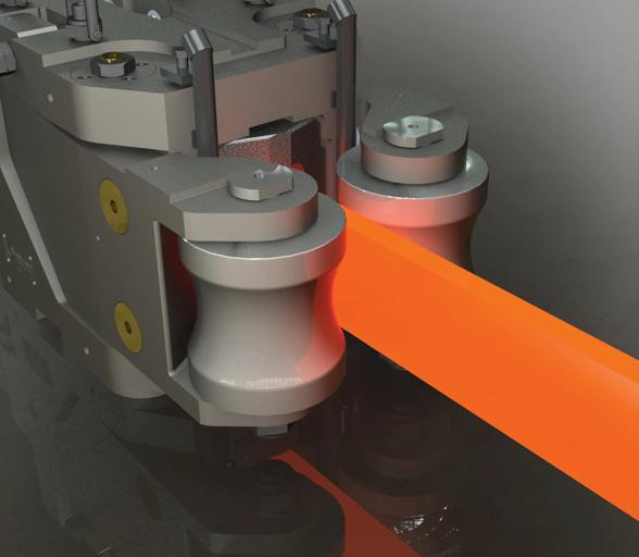 Hot steel bar exiting a roller guide in a long rolling mill, demonstrating product alignment and material handling techniques covered in guide system and roll pass training.