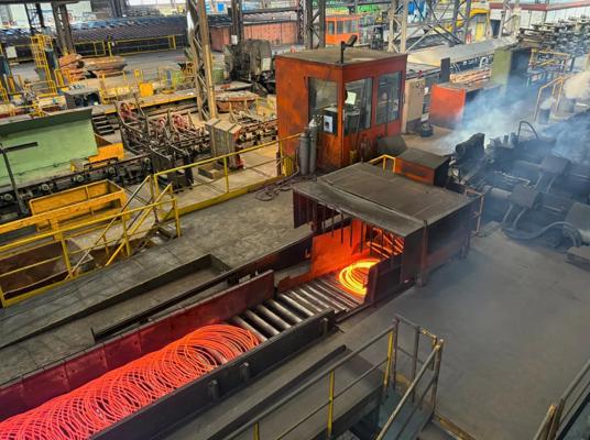 8-millimeter wire rod exiting laying head onto cooling conveyor at Stahl Gerlafingen’s new wire rod mill from Primetals Technologies. 