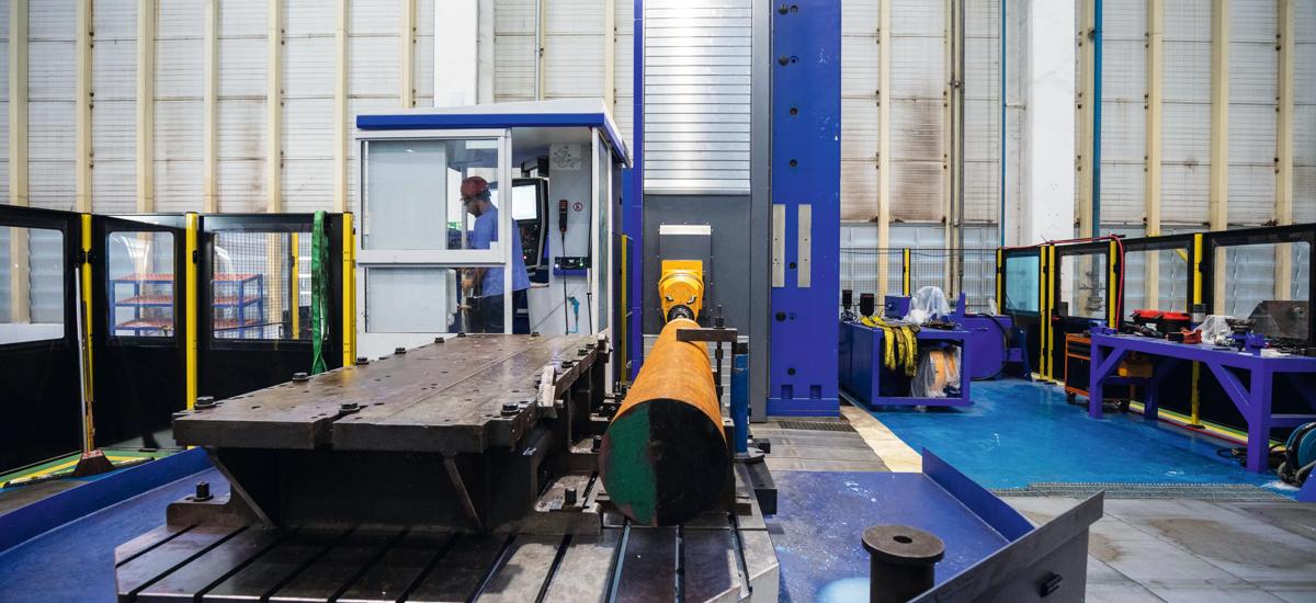 A heavy-duty TOS horizontal boring and milling machine in action, precisely machining large steel rolls for use in rolling mills and metallurgical plants