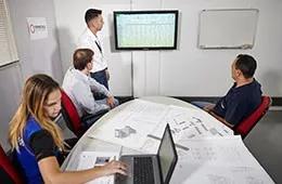 Image of a live training session featuring specialists from Primetals Technologies in a conference room 