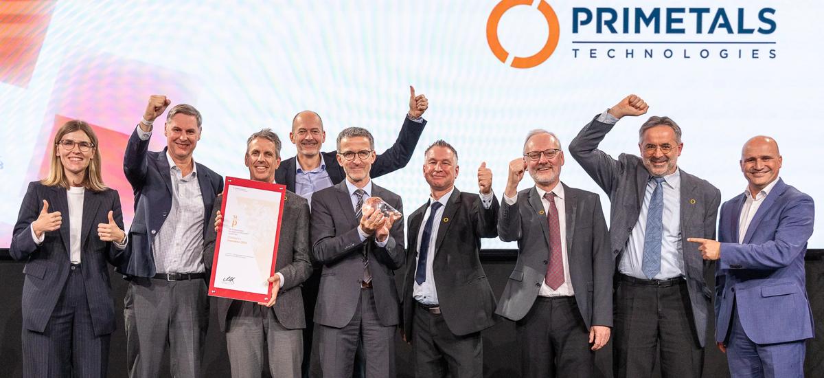 The winning team from Primetals Technologies, celebrating on stage during the ceremony for the National Prize for Innovation in Vienna.