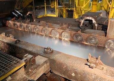 Side guides with Eco Slide Discs from Primetals Technologies at the entry side of the down coiler in the hot strip mill of voestalpine Stahl in Linz, Austria.