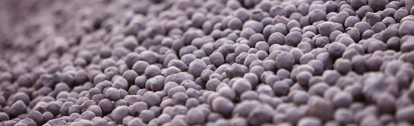 Photograph of iron ore pellets in storage