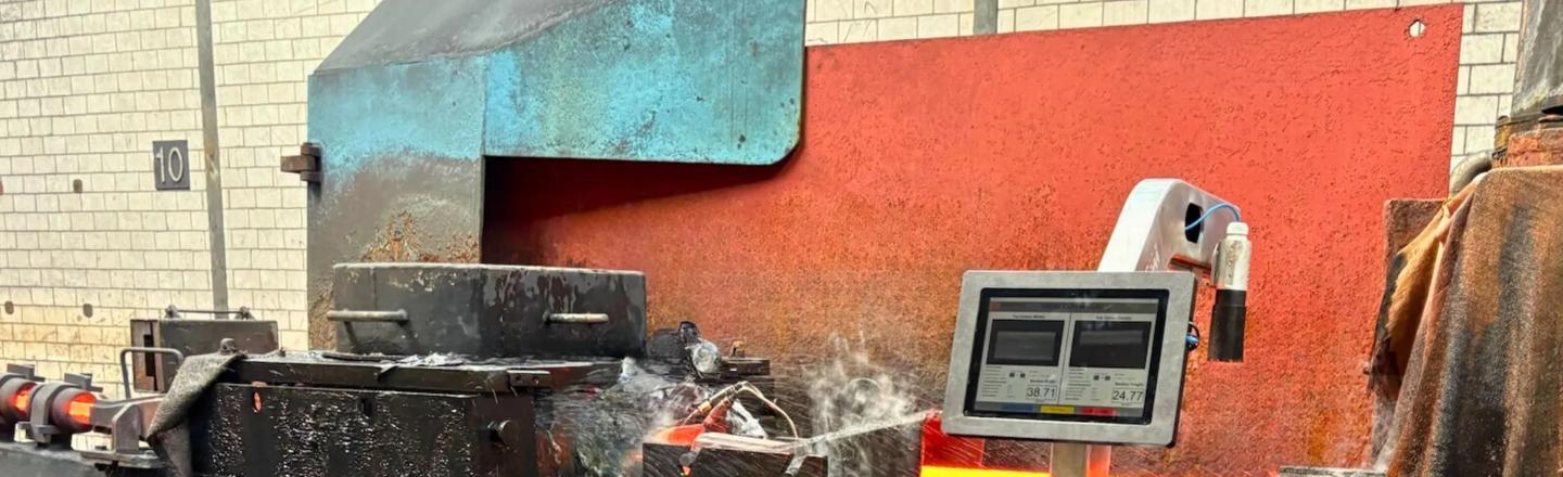 Digital Optical Caliper measuring hot rolled stock between mill stands in a long rolling mill.