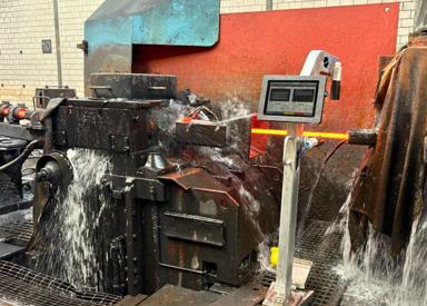 Digital Optical Caliper measuring hot rolled stock between mill stands in a long rolling mill.