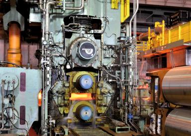Hot strip mill 4-high roughing stand with MORGOIL KLX bearing and vertical edger for heavy-duty slab reduction.