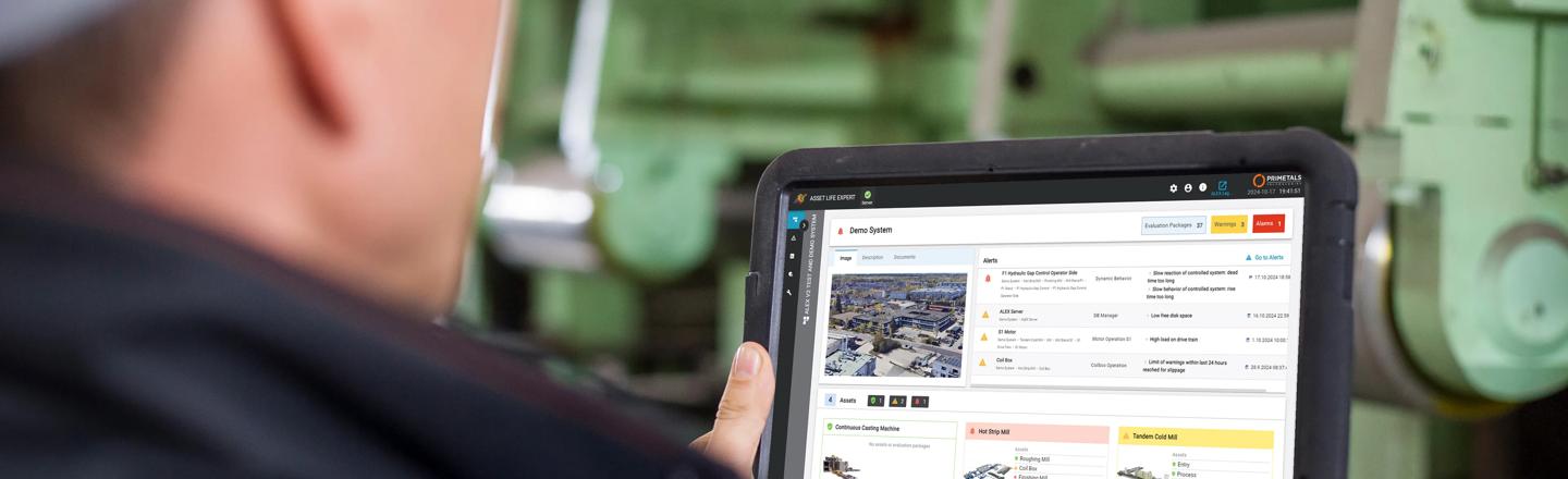 Engineer handling software Asset Life Expert (ALEX) on a tablet