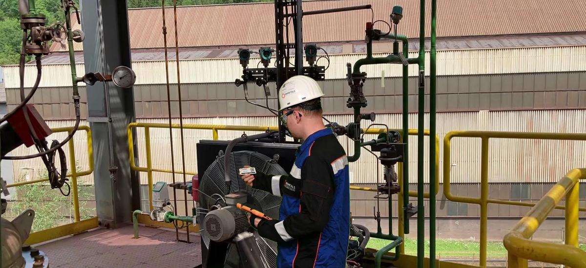 Maintenance engineers in the field inspecting a fan