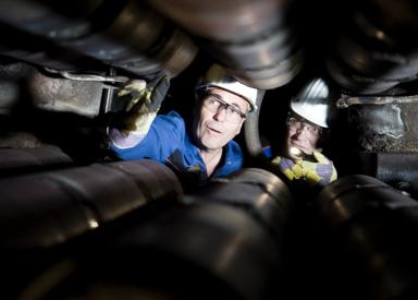 Photo of technicians inspecting a slab caster segment