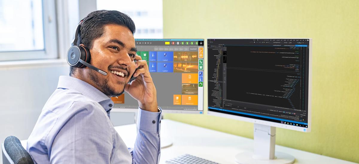 A service engineer assists a customer during a service call, helping to identify and select the correct spare parts or suitable replacement types for equipment maintenance or repair.