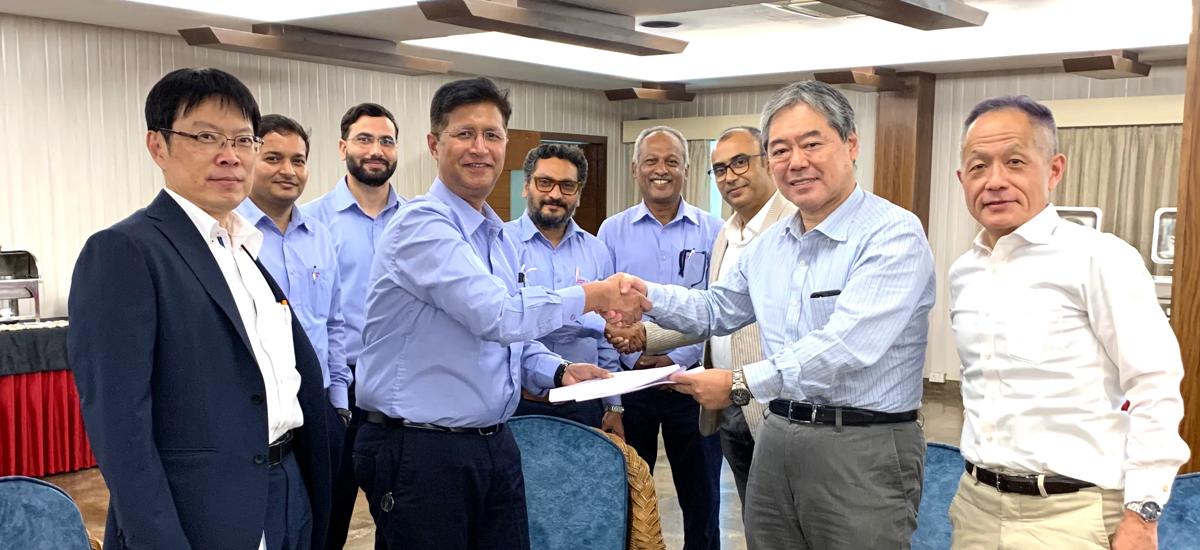 Aruni Mishra, Head of Capex procurement at ArcelorMittal Nippon Steel India and Akira Goto, Executive Director and CEO at Primetals Technologies India shakes hands during the contract signing ceremony.