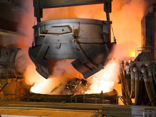 Scrap bucket charging at the Carinox steelworks of ArcelorMittal