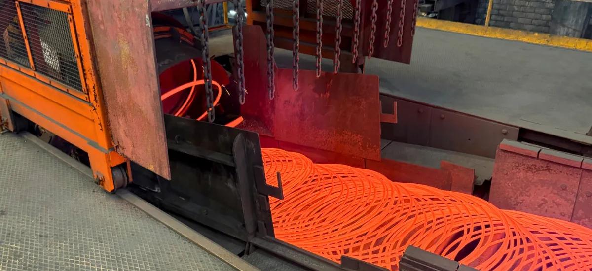 Image of close-up view of 8 millimeter wire rod exiting upgraded Morgan Laying Head